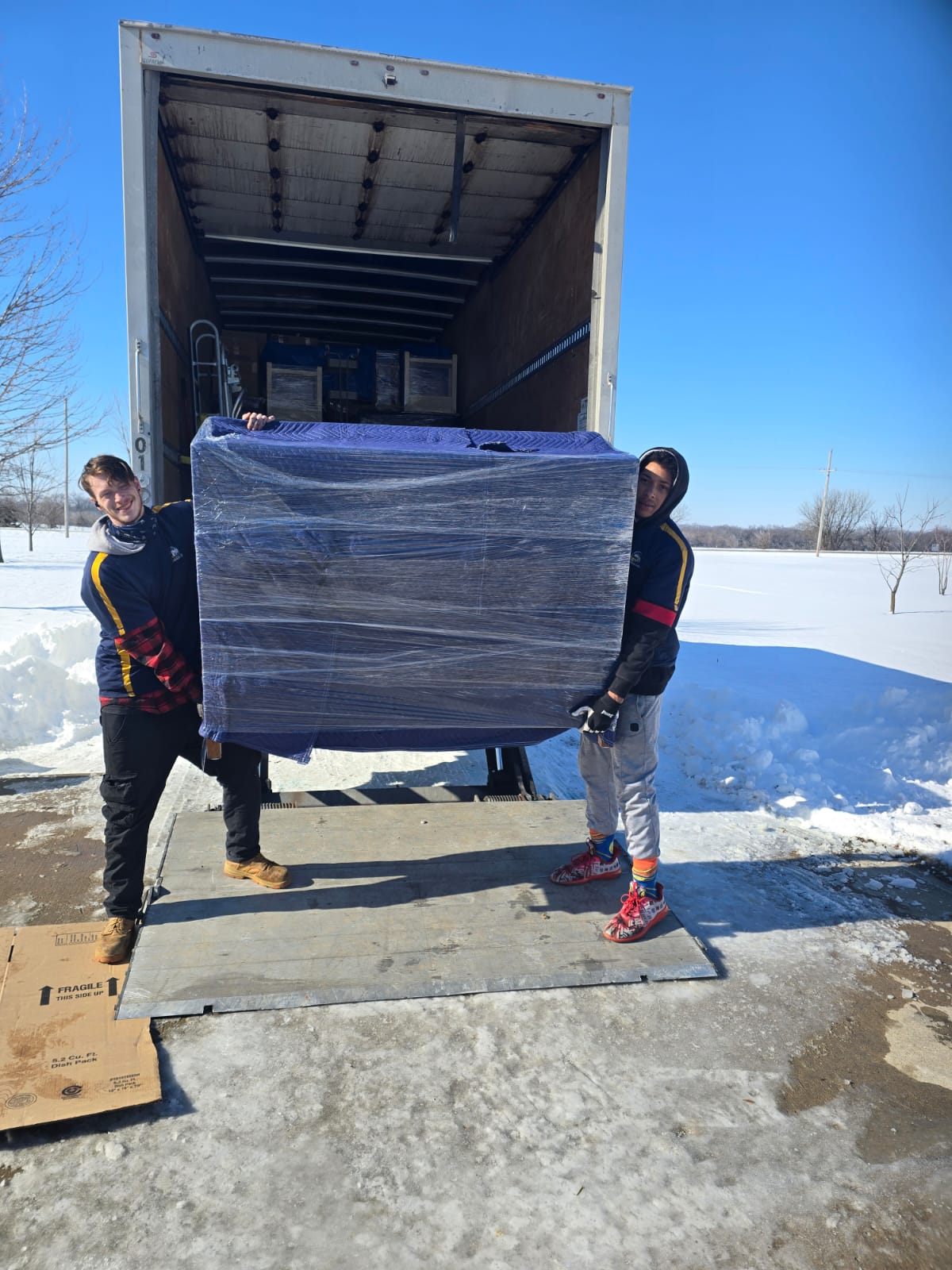 Professional movers carefully moving during winter in Kansas City